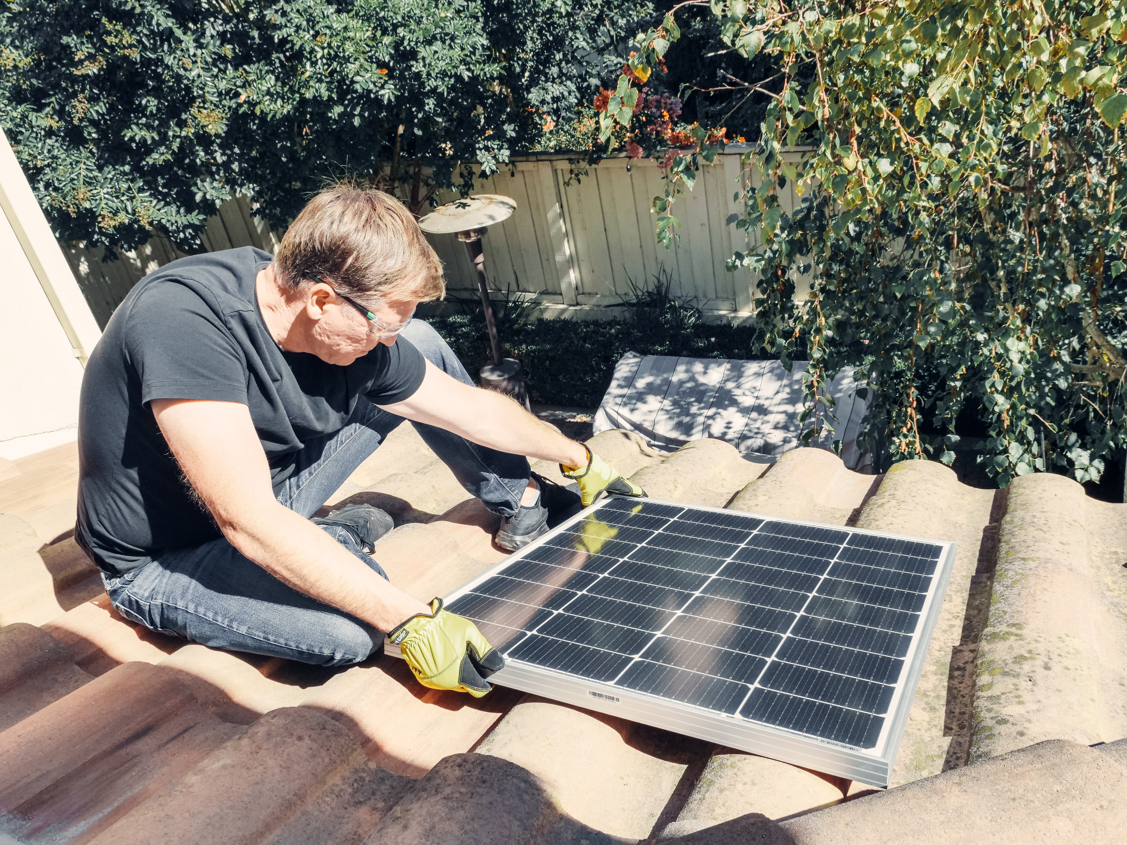 Man holding a solar panel